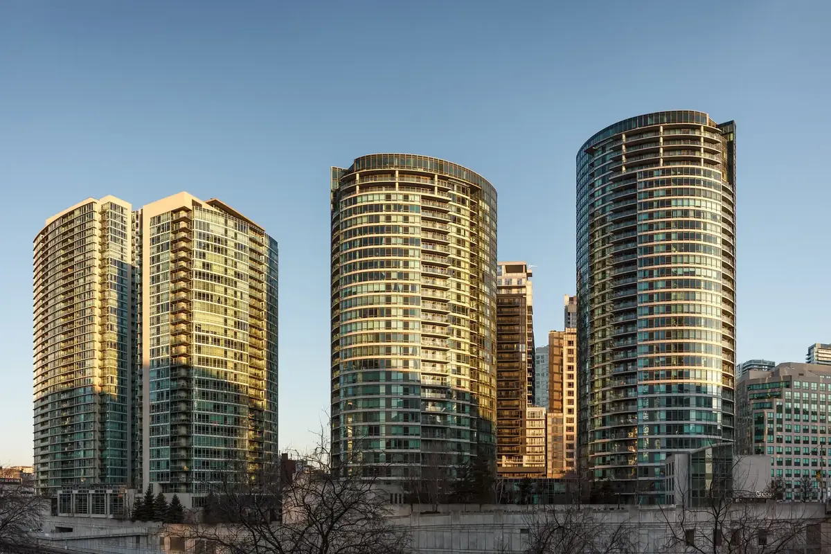 CityPlace condominium towers glowing in late-afternoon light along Front Street West, Toronto