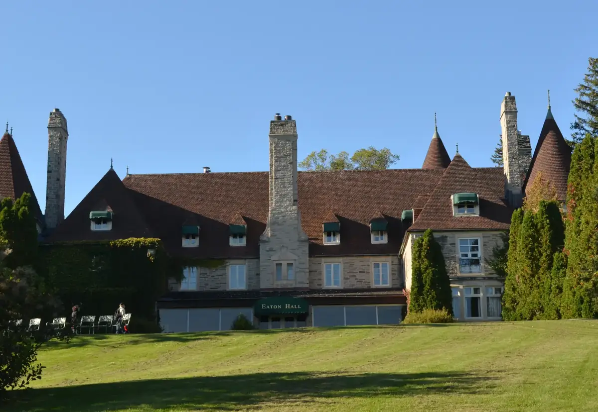Eaton Hall, a stone château-style country house above sunny lawns in King City, Ontario