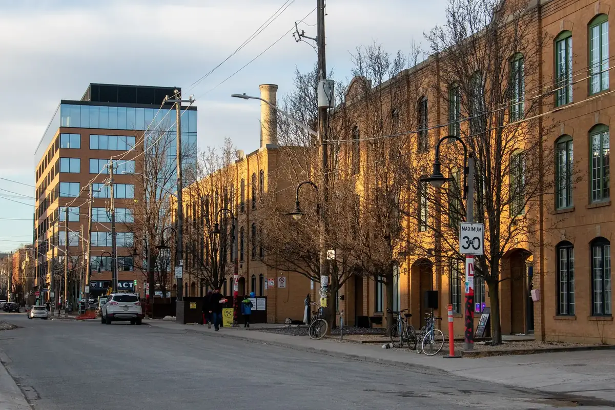 Converted brick factory lofts in warm evening light on Atlantic Avenue, Liberty Village, Toronto
