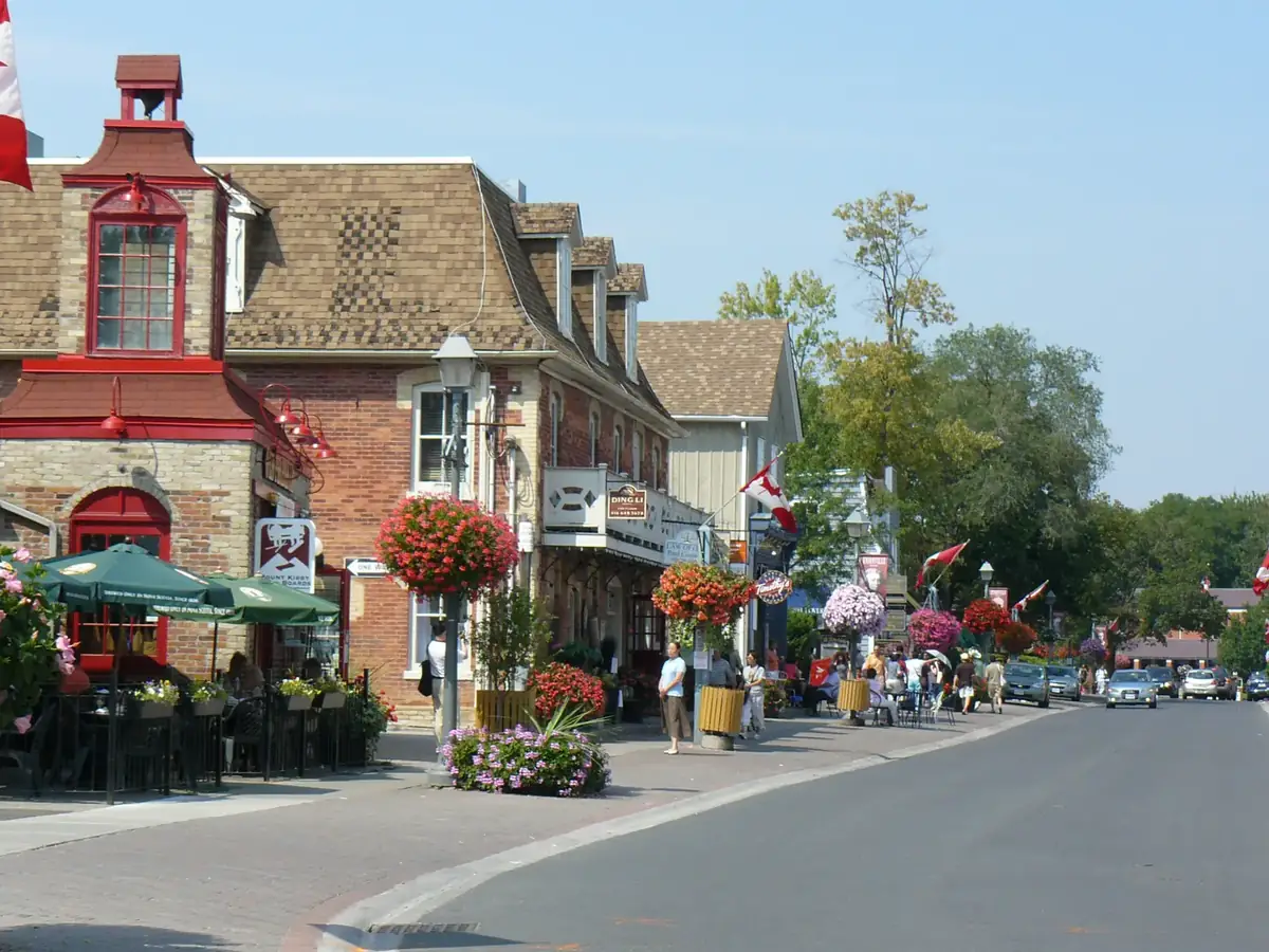 Hanging flower baskets and heritage buildings on a sunny Main Street Unionville, Markham