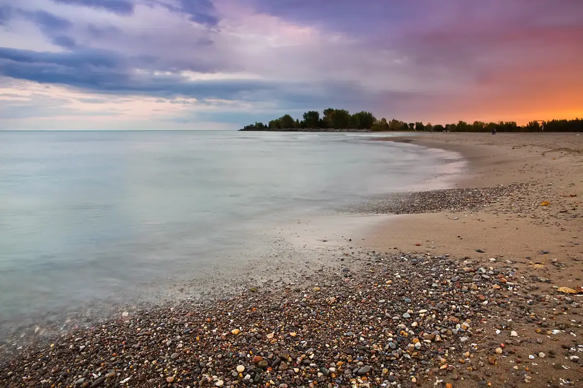 Pastel sunset over Lake Ontario and the sand at Kew Beach in The Beaches, Toronto