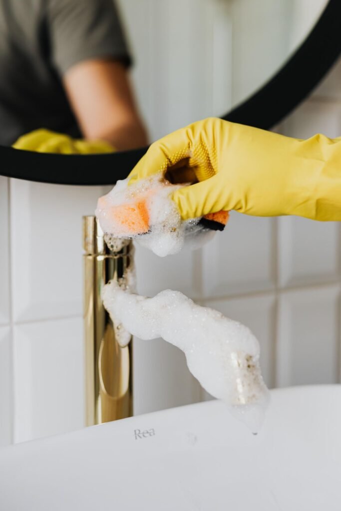 A Person Cleaning a Wooden Surface -