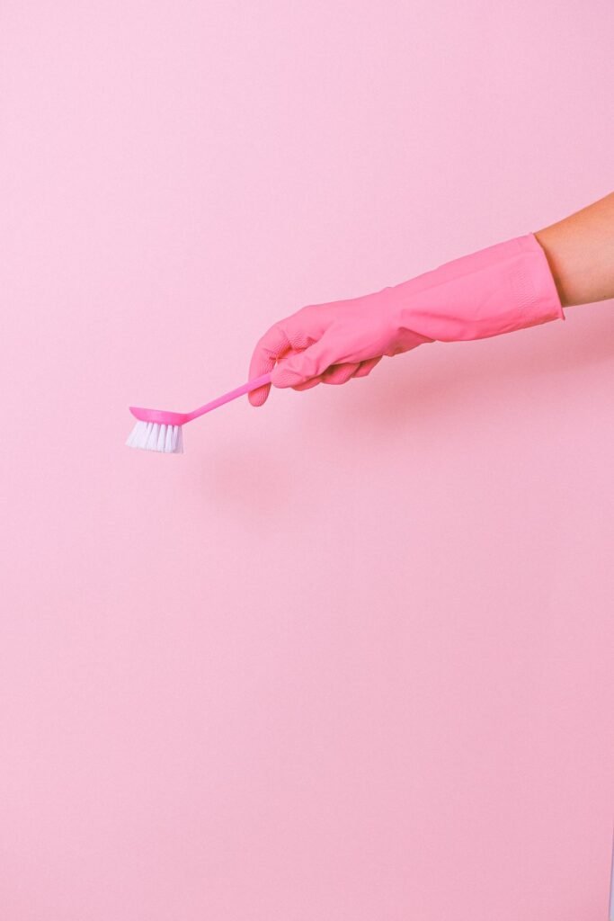 Crop housekeeper with cleaning brush -