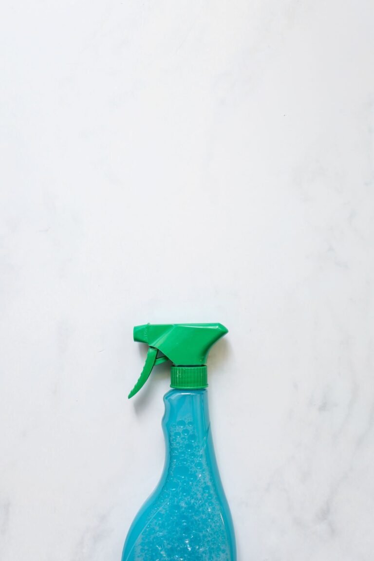Eco friendly cleaning spray bottle on a clean white surface