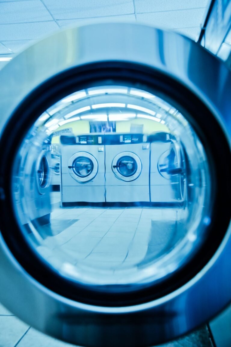 Deep blue washing machine drum seen from inside the appliance